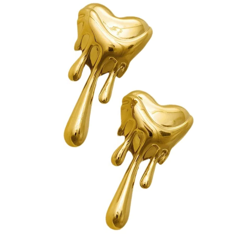 Pair of gold earrings on a white background