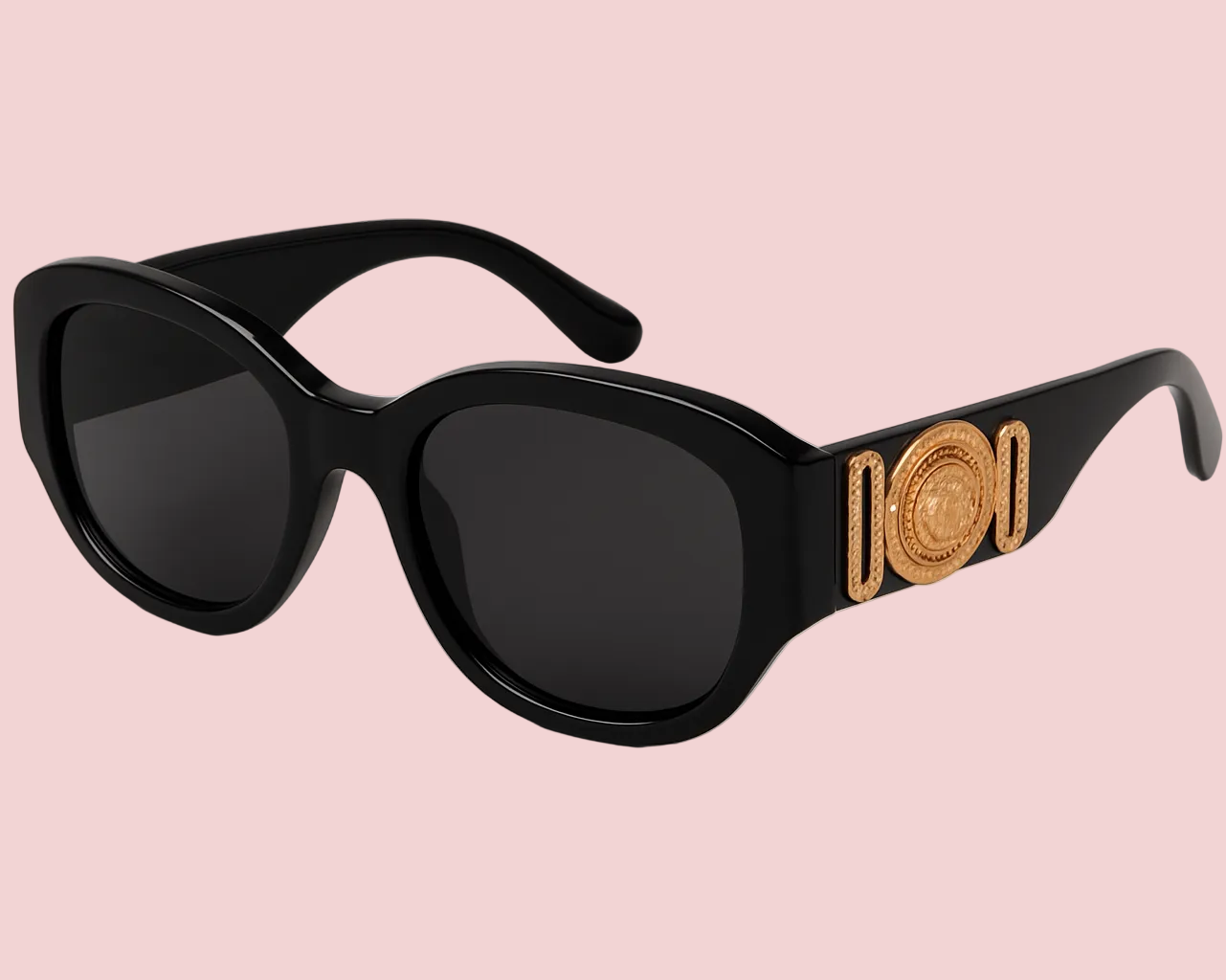 Black sunglasses with gold decorative elements on a light gray background