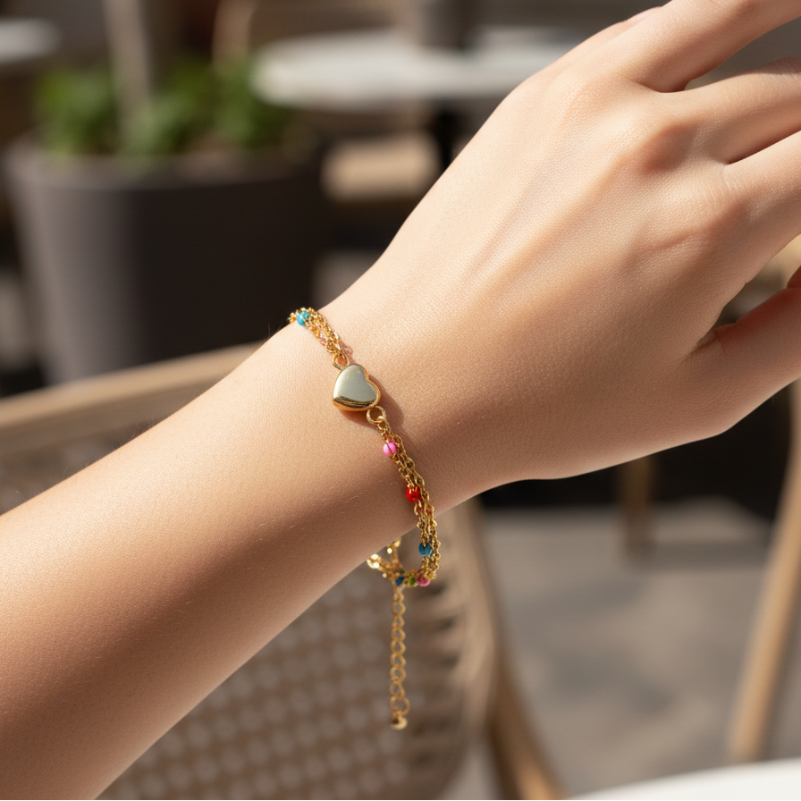 Close-up of a hand wearing a colorful bracelet with a blurred outdoor background