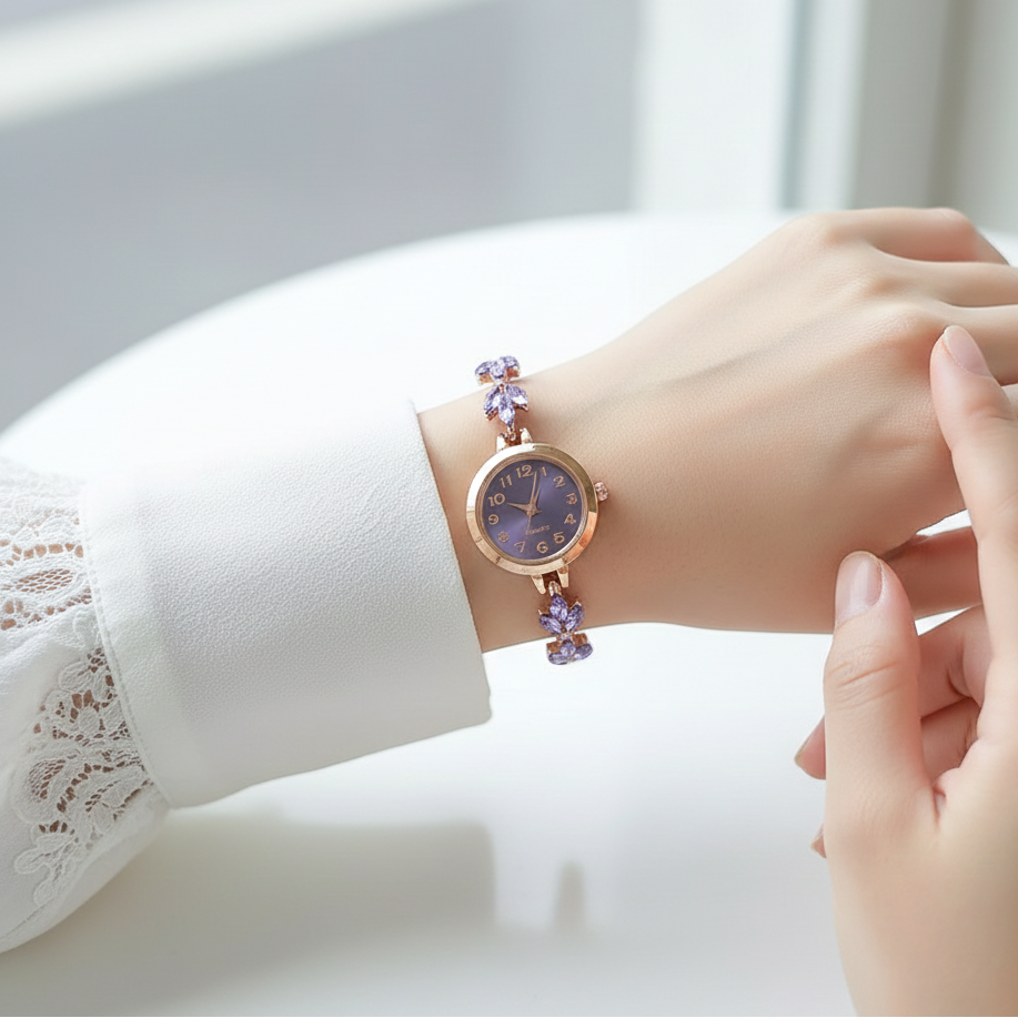 Hand wearing a delicate bracelet with a blurred background