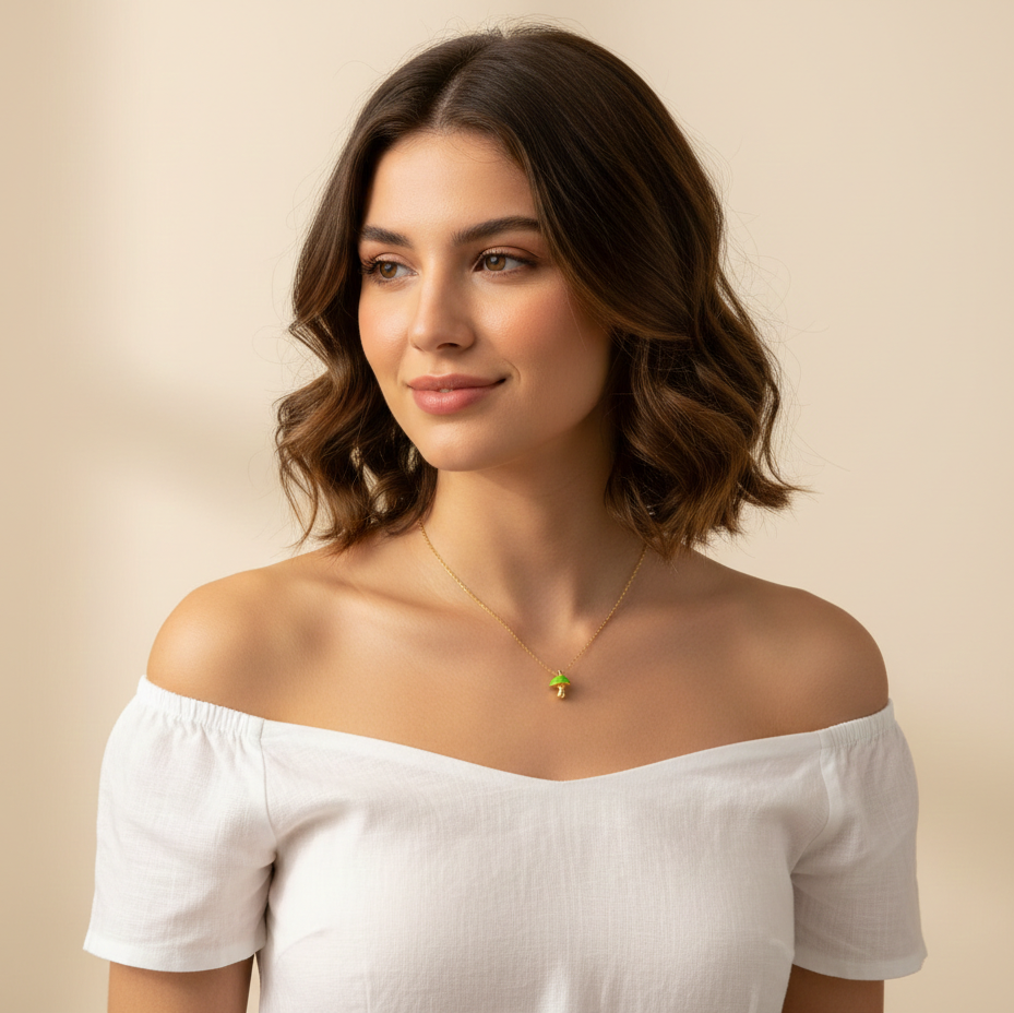 Woman wearing a white off-shoulder top and a necklace with a green pendant on a beige background