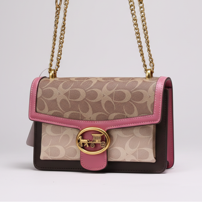 Handbag with pink and gold accents on a light gray background