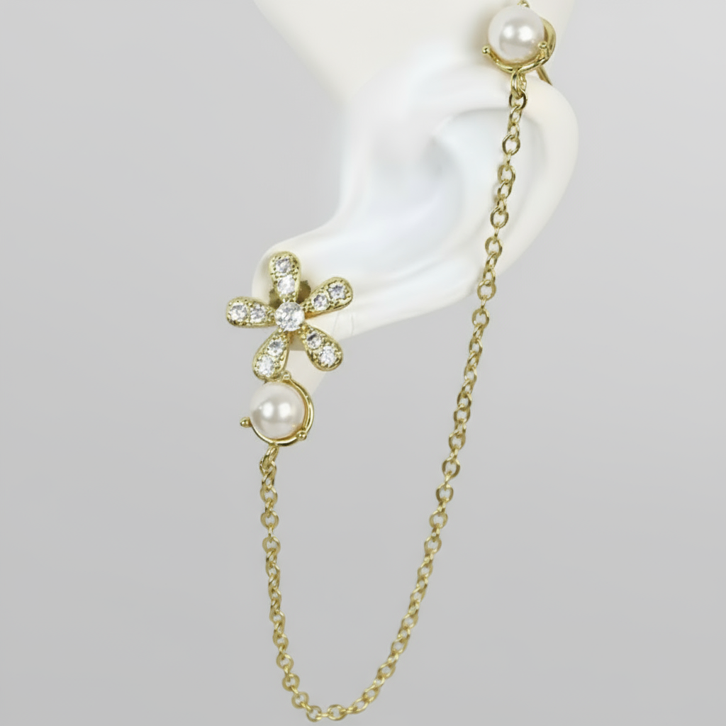 Gold chain earring with pearls on a white background