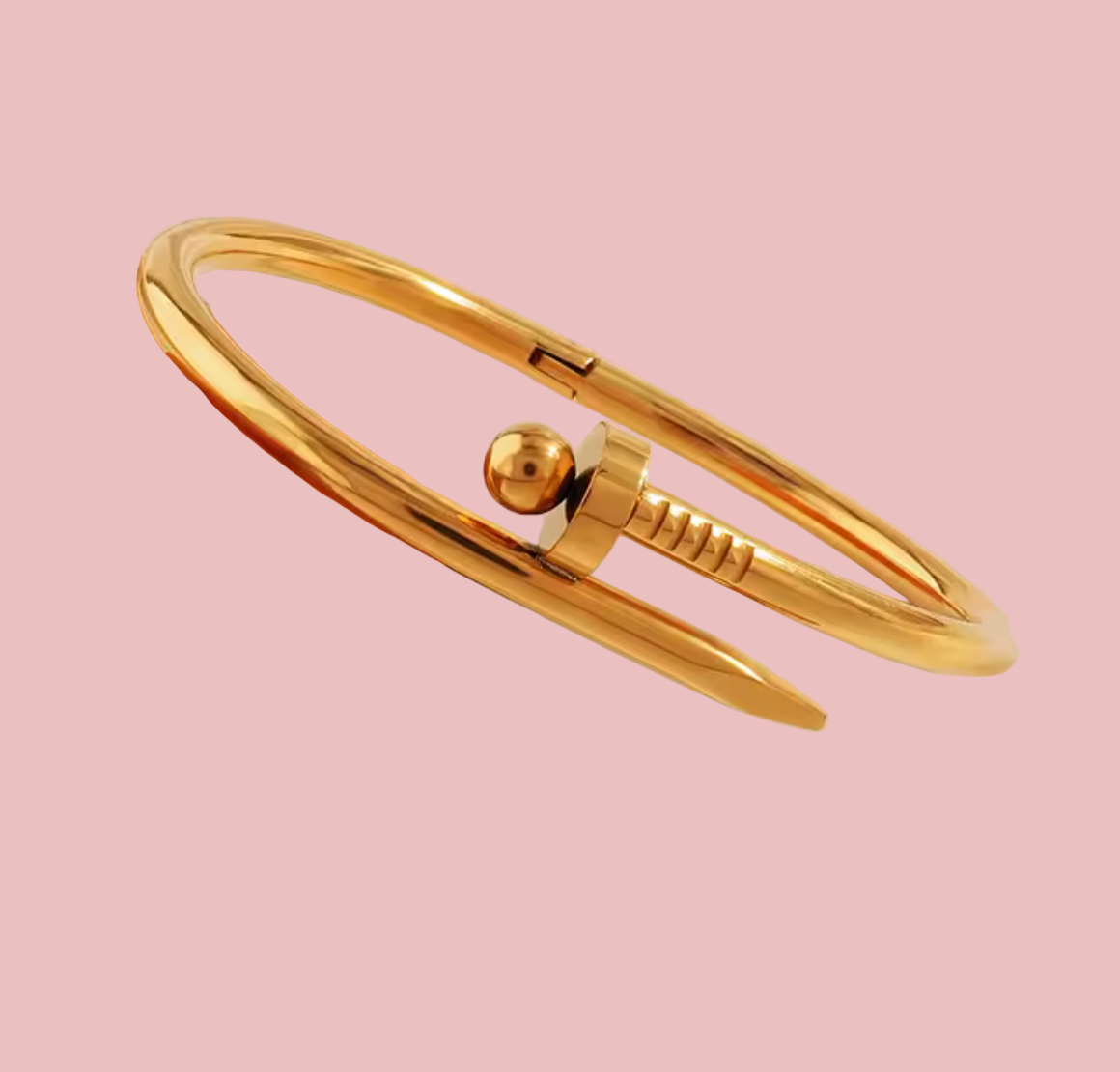 Gold bracelet on a beige background