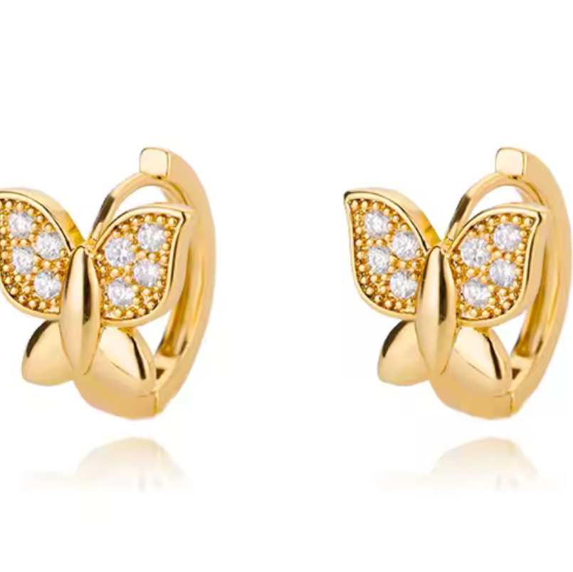 Gold butterfly earrings with diamond accents on a white background