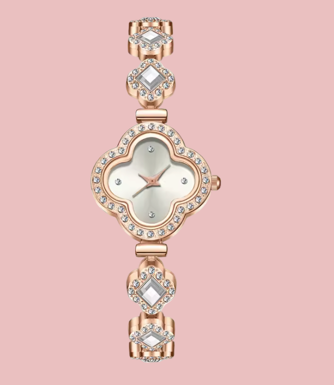 Rose gold watch with diamond-like stones on a white background
